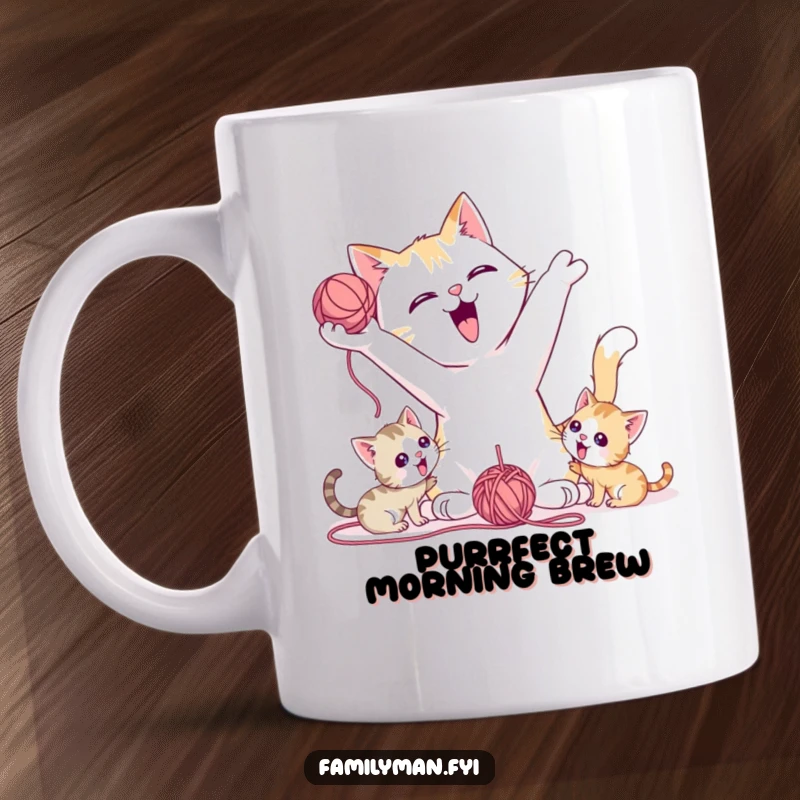 Funny Mug showing a playful father cat tossing a yarn ball for kittens, embodying joy and fun.