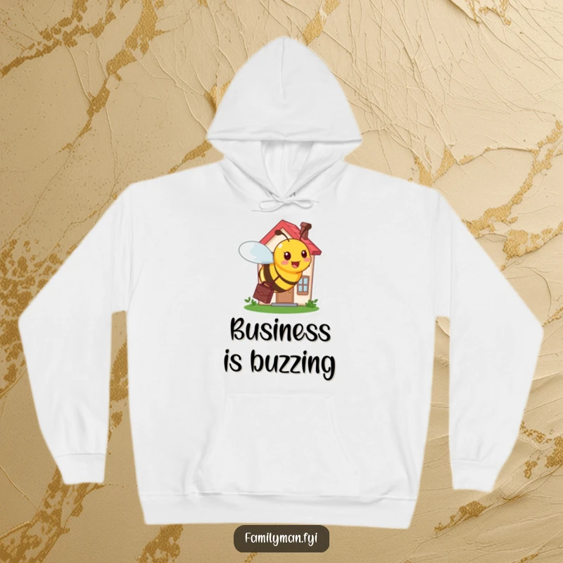 Funny hoodie showing a busy bee with a briefcase, diligently buzzing around a tiny, bustling house.