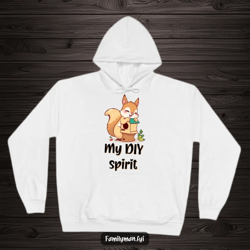 Funny playful squirrel hoodie, illustrating a squirrel diligently working on a birdhouse, offering warmth and humorous motivation for creators.