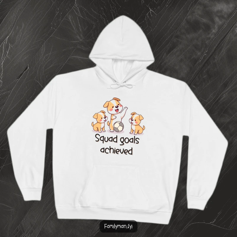 Funny hoodie depicting a playful dog tossing a ball for two happy puppies, exuding energy and puppy love.