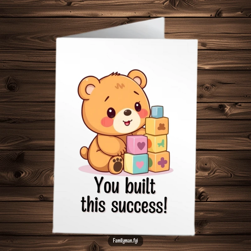 Funny free printable congratulations card with a happy bear cub focused on building a block tower, signifying achievement and joy.