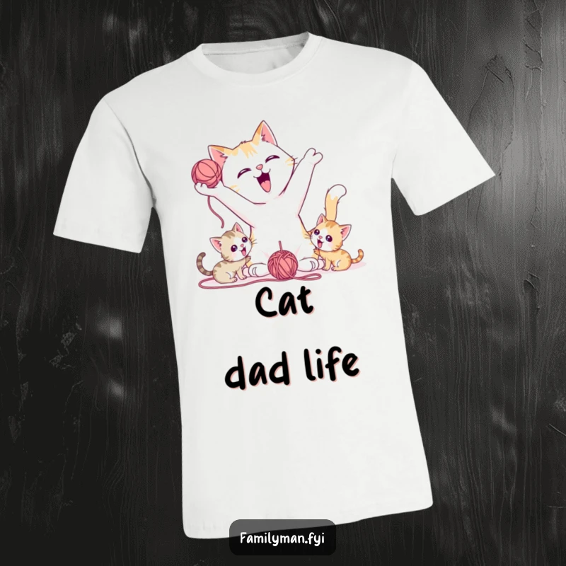 Funny T-Shirt featuring a playful father cat tossing a yarn ball for kittens, showing love and fun.