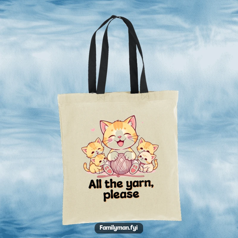 Funny tote bag with a joyful cat character playing with yarn, surrounded by playful kittens, perfect for carrying daily essentials with a touch of humor.